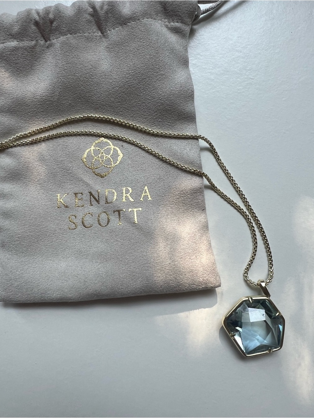 Kendra Scott Gold Necklace with Light Blue Faceted Pendant